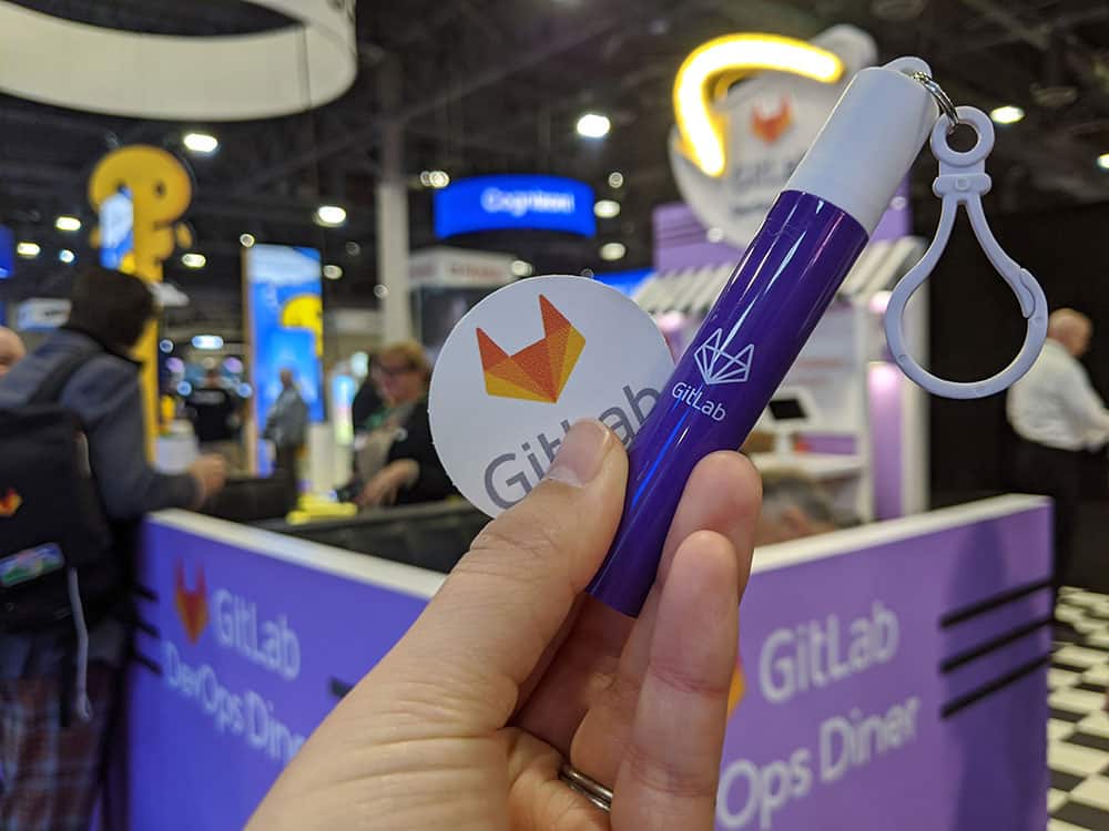 A gitLab collapsible straw and sticker.